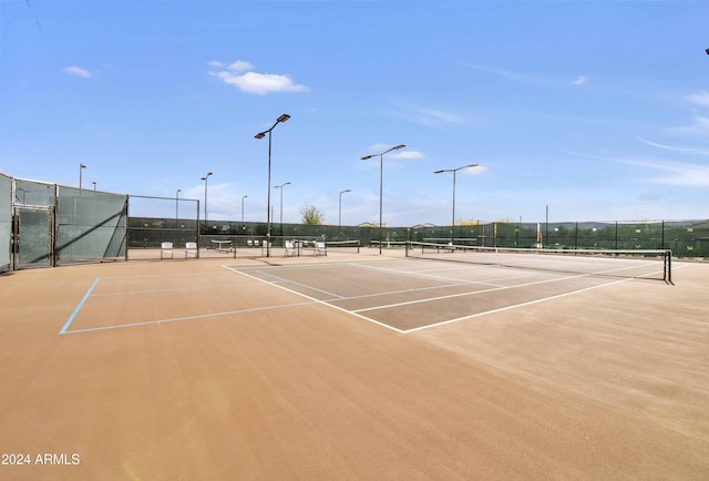 view of tennis court featuring basketball court