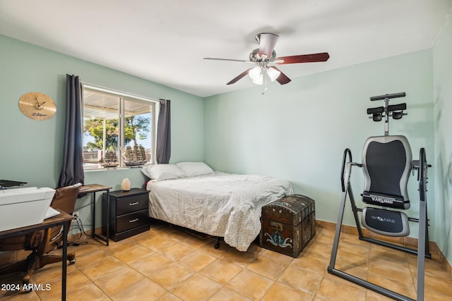 tiled bedroom with ceiling fan