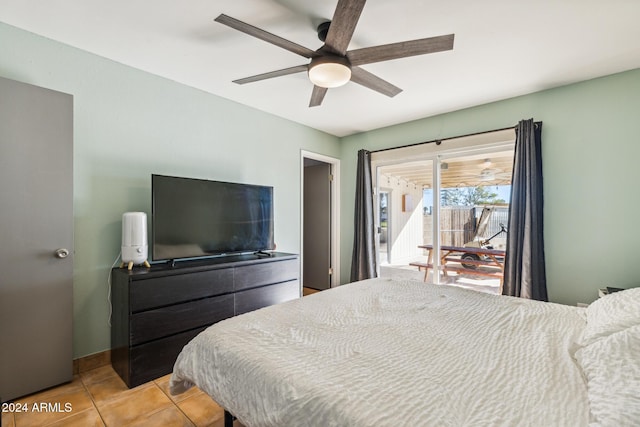 tiled bedroom with ceiling fan