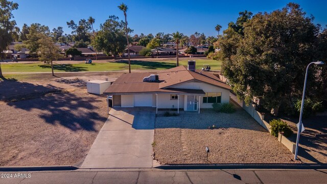 view of front of house with a garage and a front yard