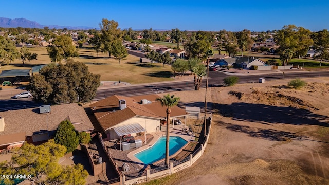 birds eye view of property with a mountain view