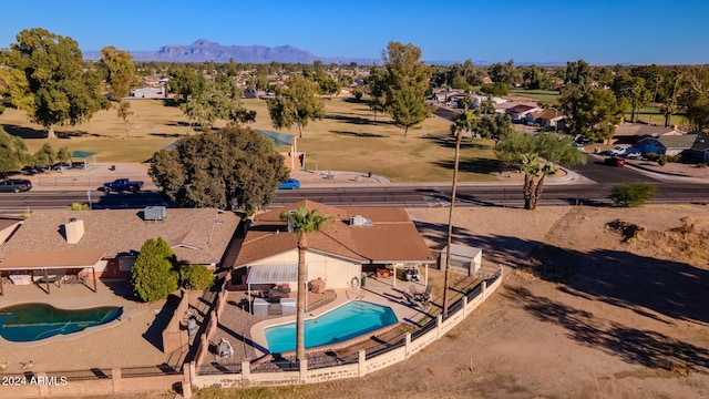 birds eye view of property featuring a mountain view