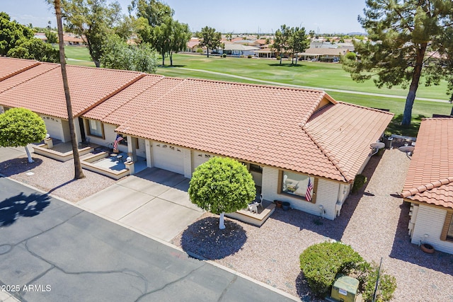 aerial view with view of golf course and a residential view