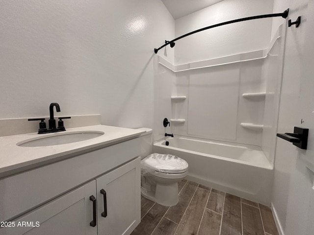 full bathroom with vanity, toilet, bathtub / shower combination, and wood tiled floor