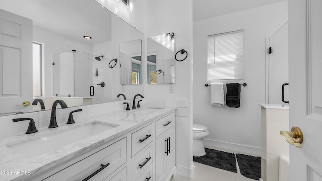 full bath with a shower stall, double vanity, baseboards, toilet, and tile patterned flooring