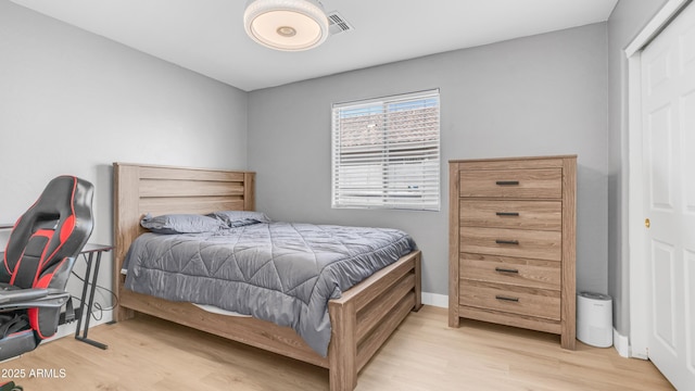 bedroom with wood finished floors
