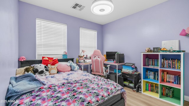 bedroom with wood finished floors