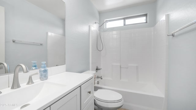 full bath with toilet, vanity, and washtub / shower combination