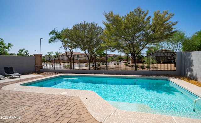 view of swimming pool featuring fence and a patio area
