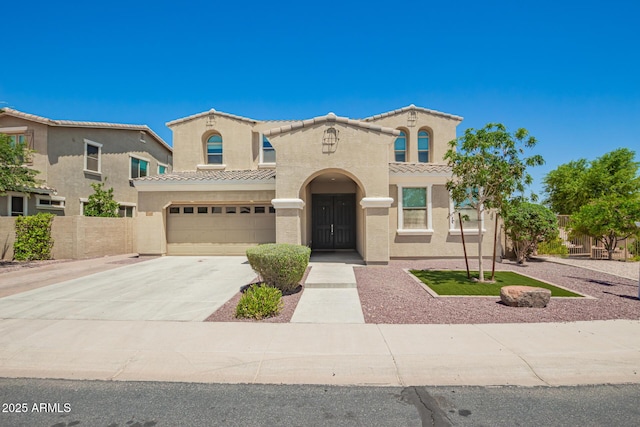 2920 E Virginia St E, Mesa, AZ 85213 - mediterranean / spanish home with concrete driveway, an attached garage, a tiled roof, and stucco siding