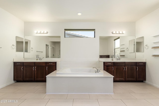 2920 E Virginia St E, Mesa, AZ 85213 - bathroom with a garden tub, two vanities, a shower stall, and baseboards