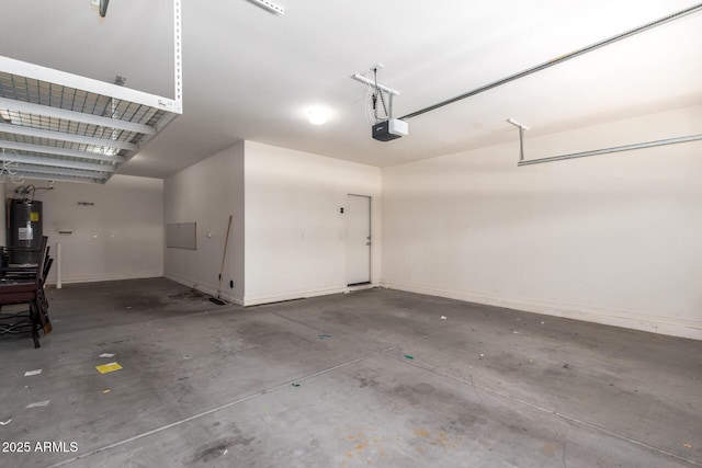 2920 E Virginia St E, Mesa, AZ 85213 - garage featuring electric water heater, a garage door opener, and baseboards