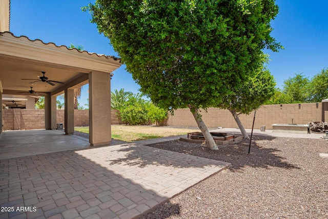 2920 E Virginia St E, Mesa, AZ 85213 - fenced backyard featuring a ceiling fan and a patio area