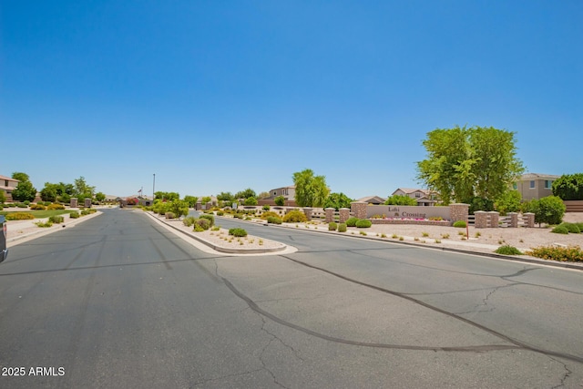 2920 E Virginia St E, Mesa, AZ 85213 - view of asphalt road featuring curbs, a residential view, and sidewalks