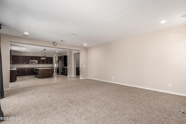 2920 E Virginia St E, Mesa, AZ 85213 - unfurnished living room with light carpet, recessed lighting, and baseboards