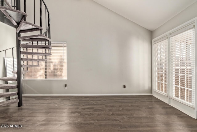 interior space with vaulted ceiling and dark hardwood / wood-style floors