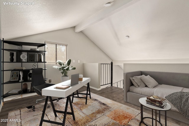 home office with hardwood / wood-style flooring, a textured ceiling, and vaulted ceiling with beams