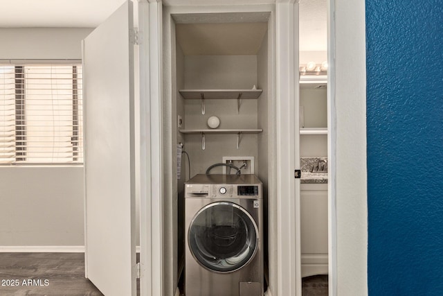 laundry area with washer / dryer and dark hardwood / wood-style flooring