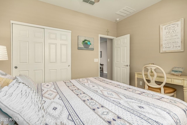 bedroom featuring a closet and visible vents