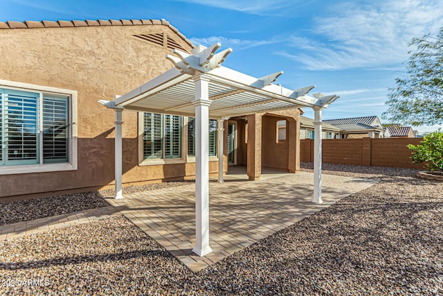 view of patio / terrace with fence and a pergola