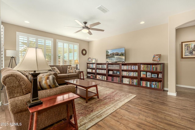 living area with baseboards, visible vents, a ceiling fan, wood finished floors, and recessed lighting