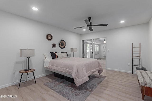 bedroom with ceiling fan and light hardwood / wood-style floors