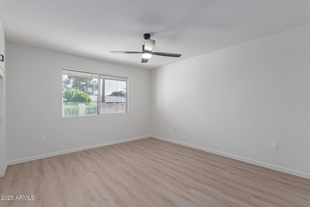 empty room featuring light wood-type flooring and ceiling fan