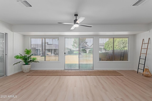 spare room featuring light hardwood / wood-style floors and ceiling fan