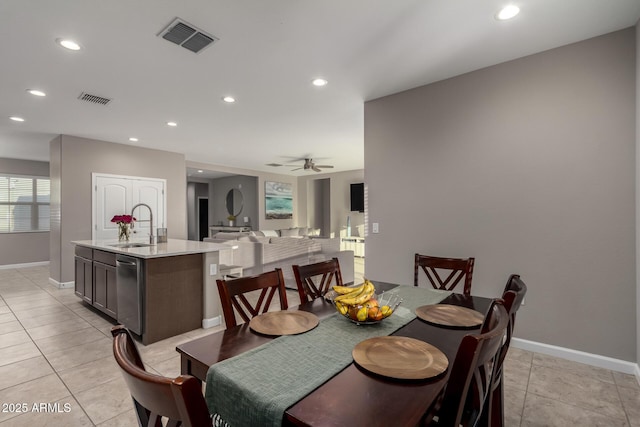 dining space featuring light tile patterned floors, baseboards, visible vents, and recessed lighting