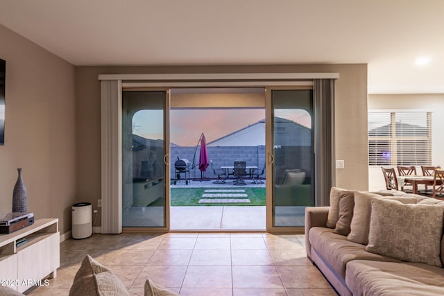 living area with light tile patterned floors