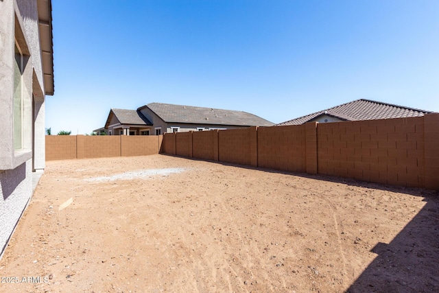 view of yard featuring a fenced backyard