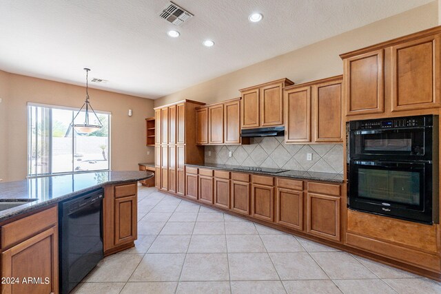 kitchen with black appliances, light tile patterned flooring, dark stone counters, and tasteful backsplash