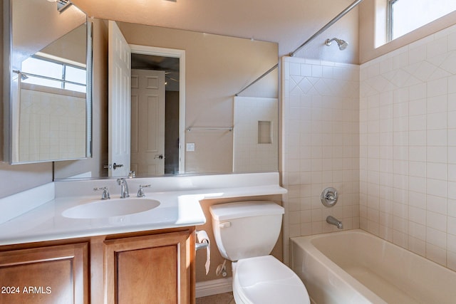 full bathroom featuring toilet, vanity, and bathtub / shower combination