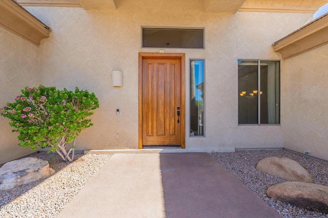 doorway to property with stucco siding