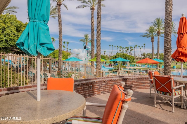 view of patio / terrace featuring outdoor dining space and fence