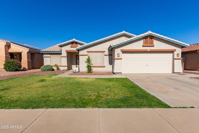 view of front of property with a front yard and a garage