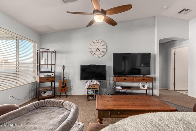 carpeted living room featuring ceiling fan