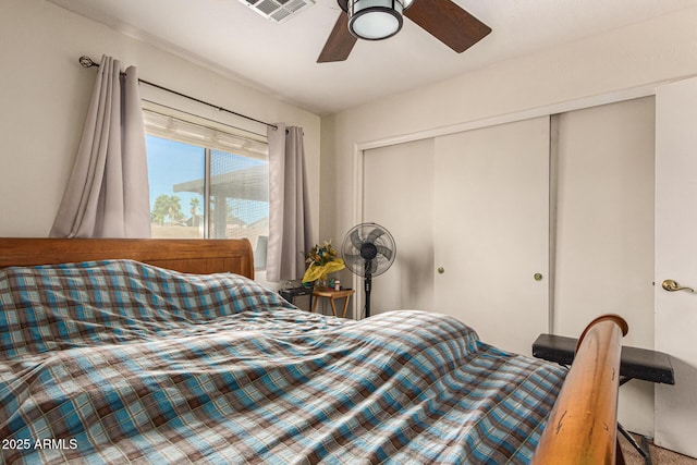 bedroom featuring ceiling fan and a closet