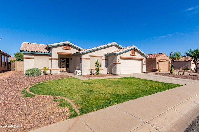 mediterranean / spanish-style home with a front lawn and a garage