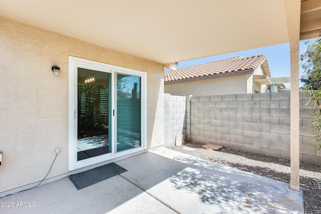 view of patio / terrace featuring fence