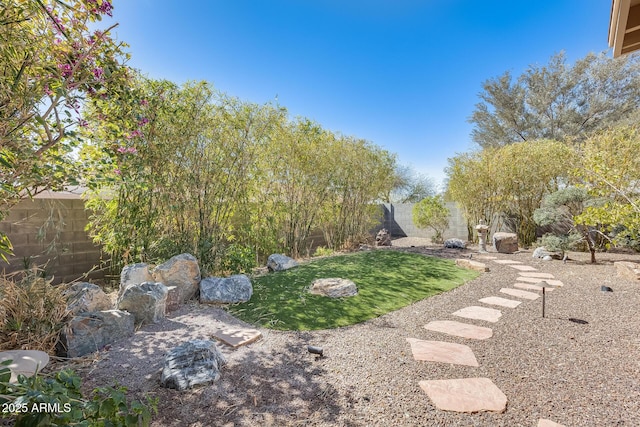 view of yard featuring a fenced backyard