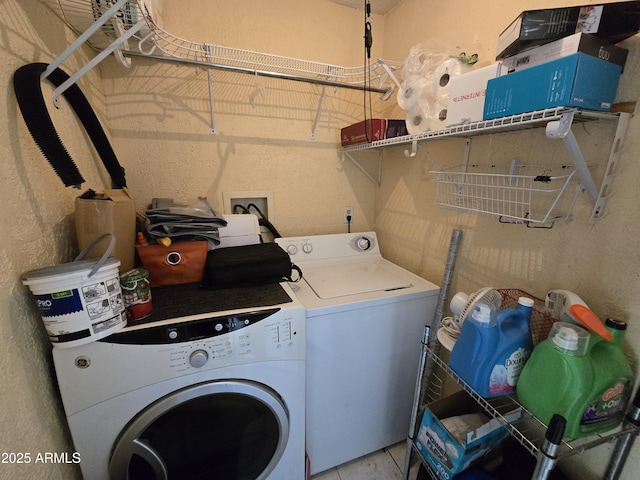 washroom featuring washer and dryer and laundry area