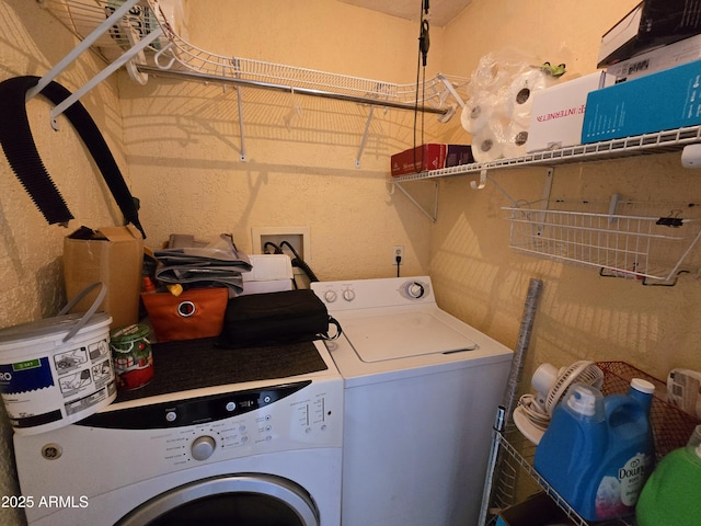 washroom with laundry area and independent washer and dryer