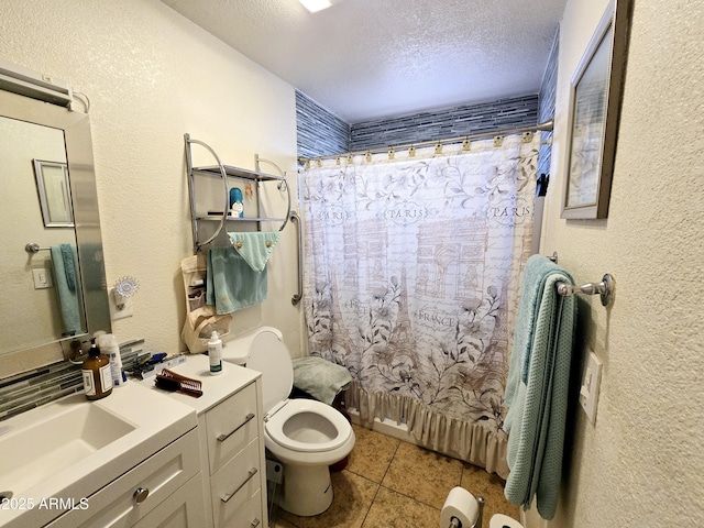 bathroom with a textured ceiling, toilet, tile patterned flooring, a textured wall, and vanity