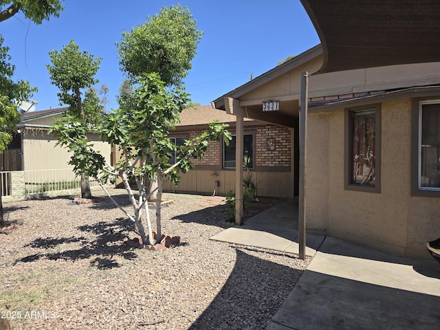 view of yard with fence and a patio