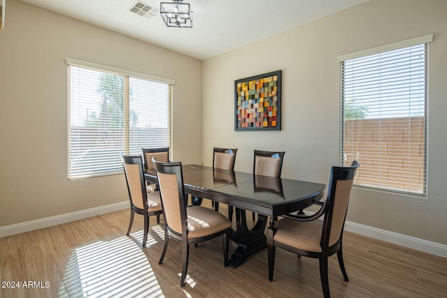 dining space featuring wood-type flooring