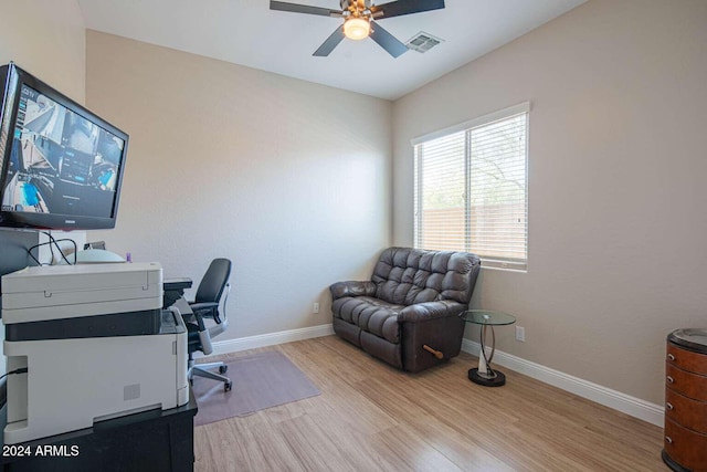 office space with ceiling fan and light hardwood / wood-style floors