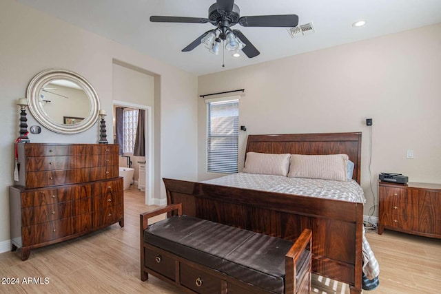 bedroom featuring ceiling fan, light wood-type flooring, and connected bathroom