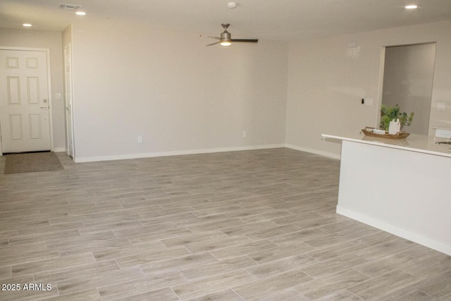 unfurnished room featuring ceiling fan and light hardwood / wood-style floors