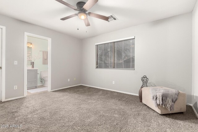 14919 W Hearn Cir, Surprise, AZ 85379 - unfurnished bedroom with carpet flooring, baseboards, and ensuite bathroom